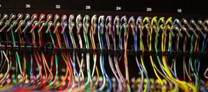 A photo of the wiring interconnecting servers in a data center deployment.