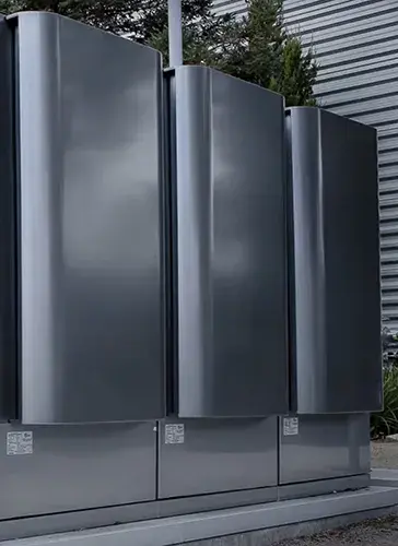 An image showing two Bloom Energy fuel cells located onsite near a data center.