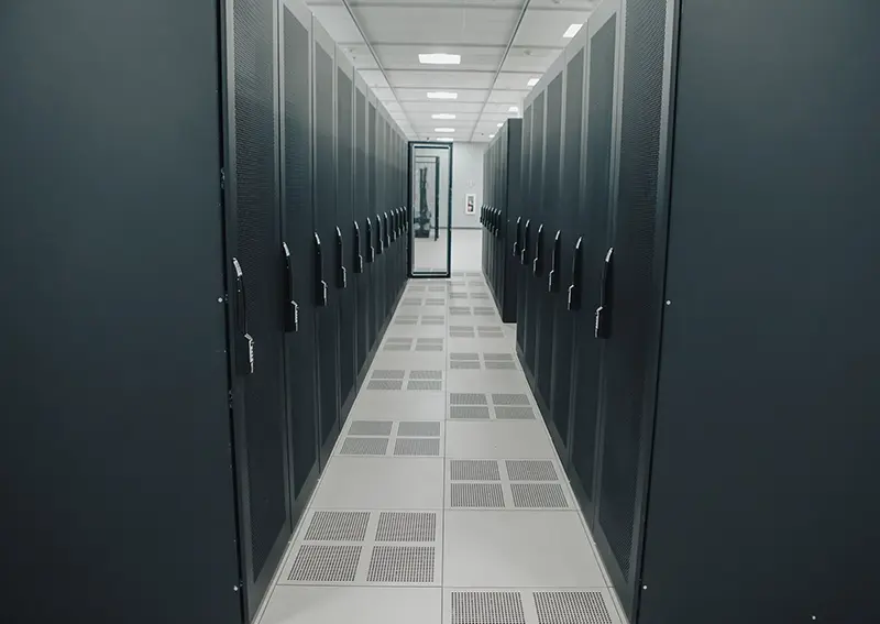 A photograph of a row of server cabinets in a data center.