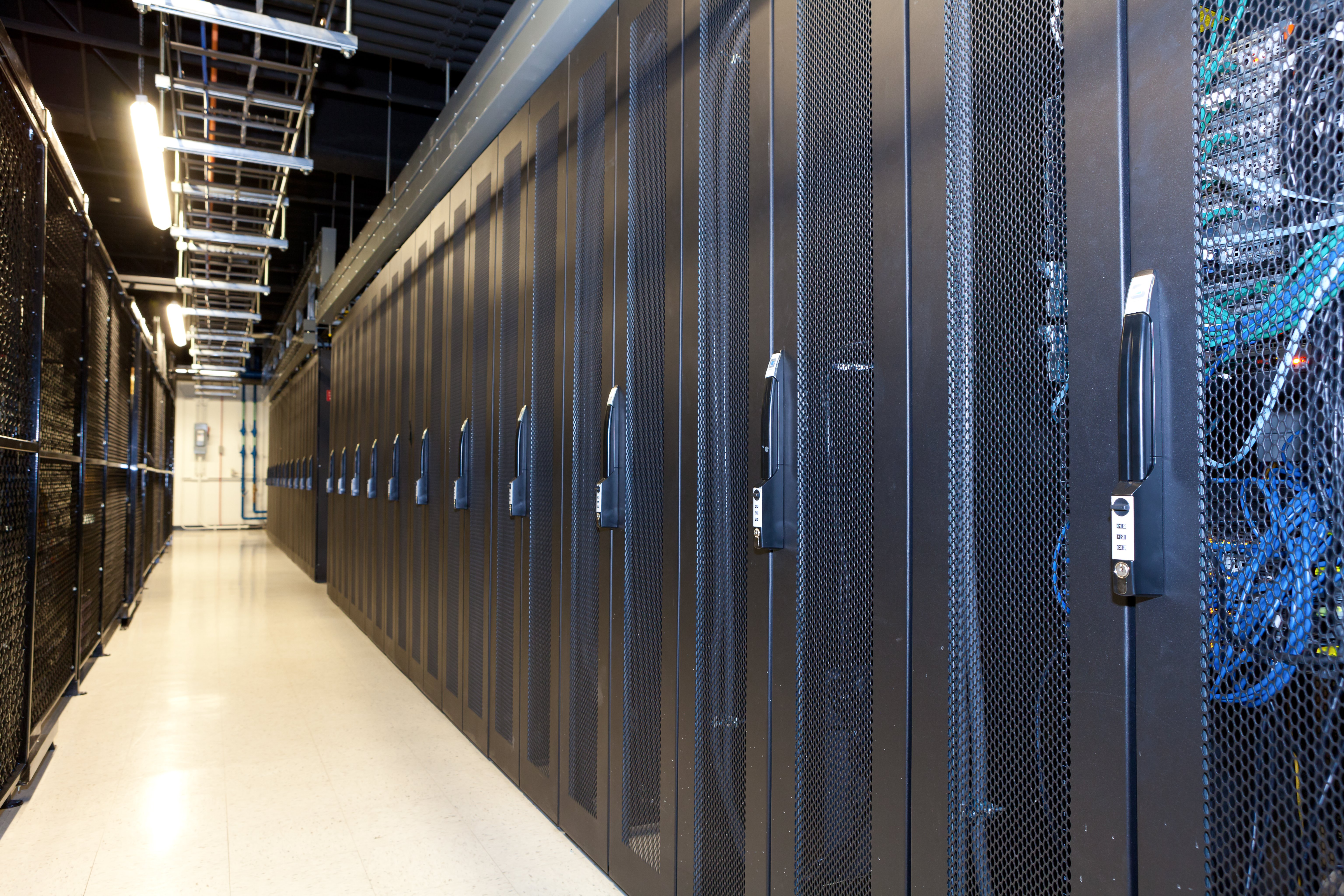 A photograph of a wall of computer servers in a data center.