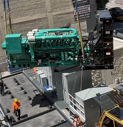 A photo of a generator at One Wilshire being moved by a crane.