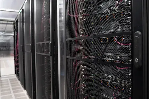 A photo of a rack of servers showing cross connects in teh CH2 cata center.