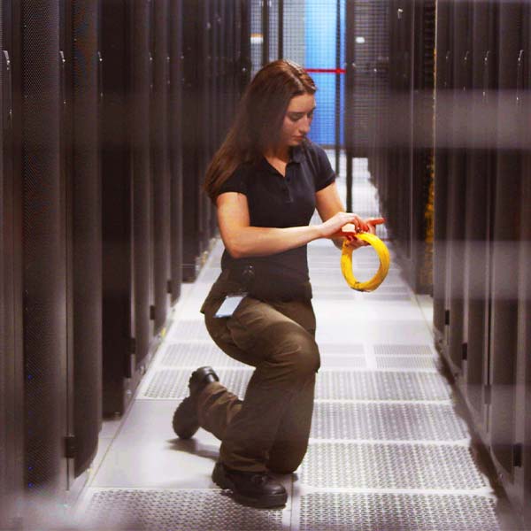 Female colocation data center technician